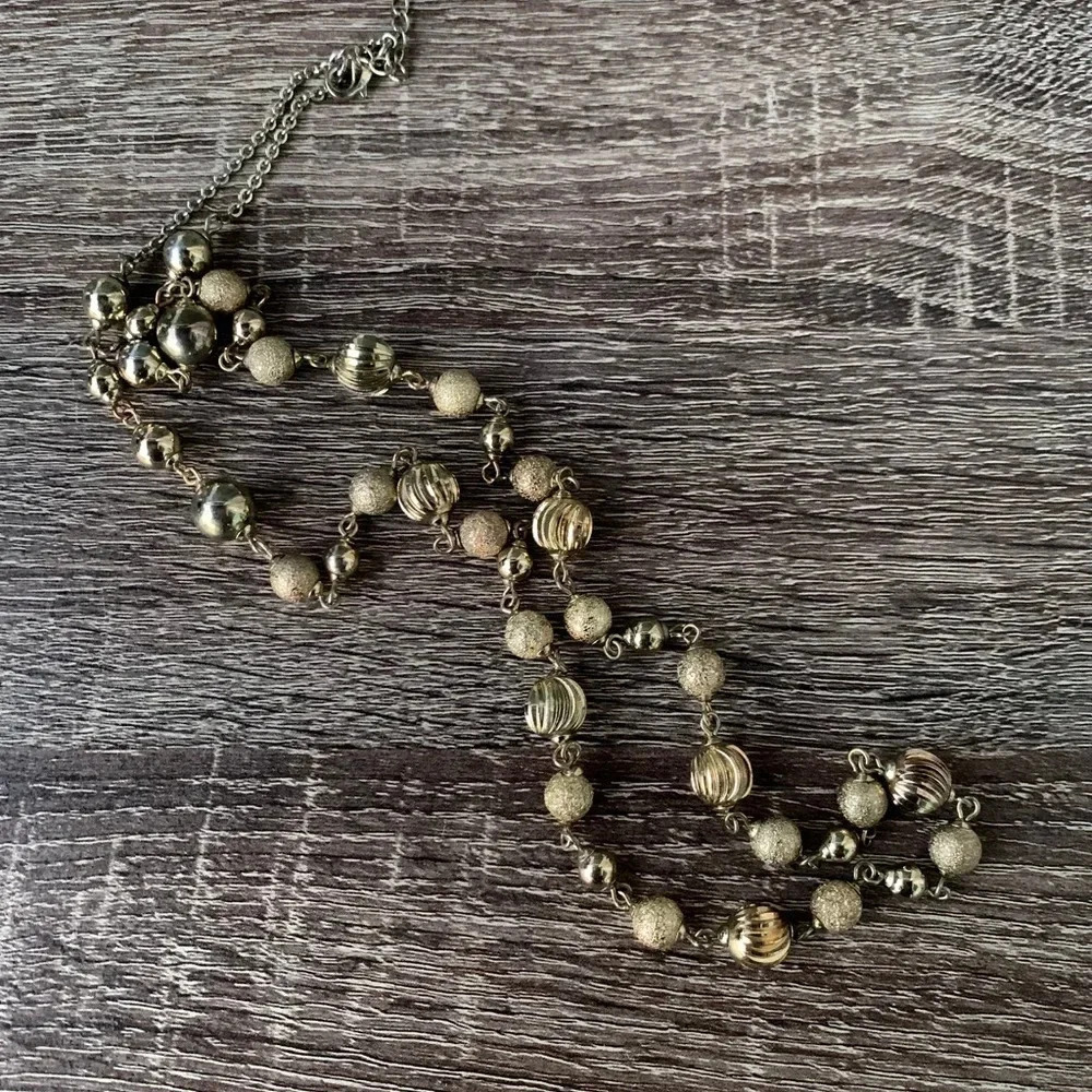 Vintage Monet Gold-Tone Alternating Textures Ball Beaded
Long Necklace Women’s
